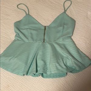 Light blue/teal zip-up crop top